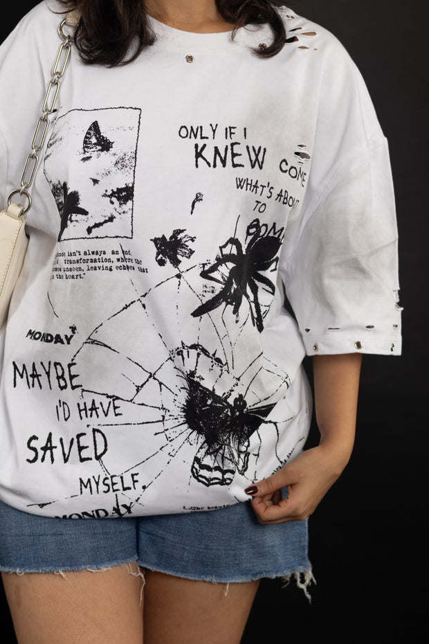 White t-shirt with black graphic designs and text
