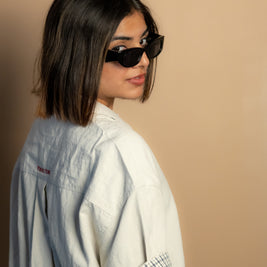 stone-colored Camp Shirt, a beige short-sleeve button-up featuring classic plaid trim