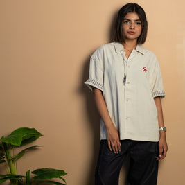 stone-colored Camp Shirt, a beige short-sleeve button-up featuring classic plaid trim