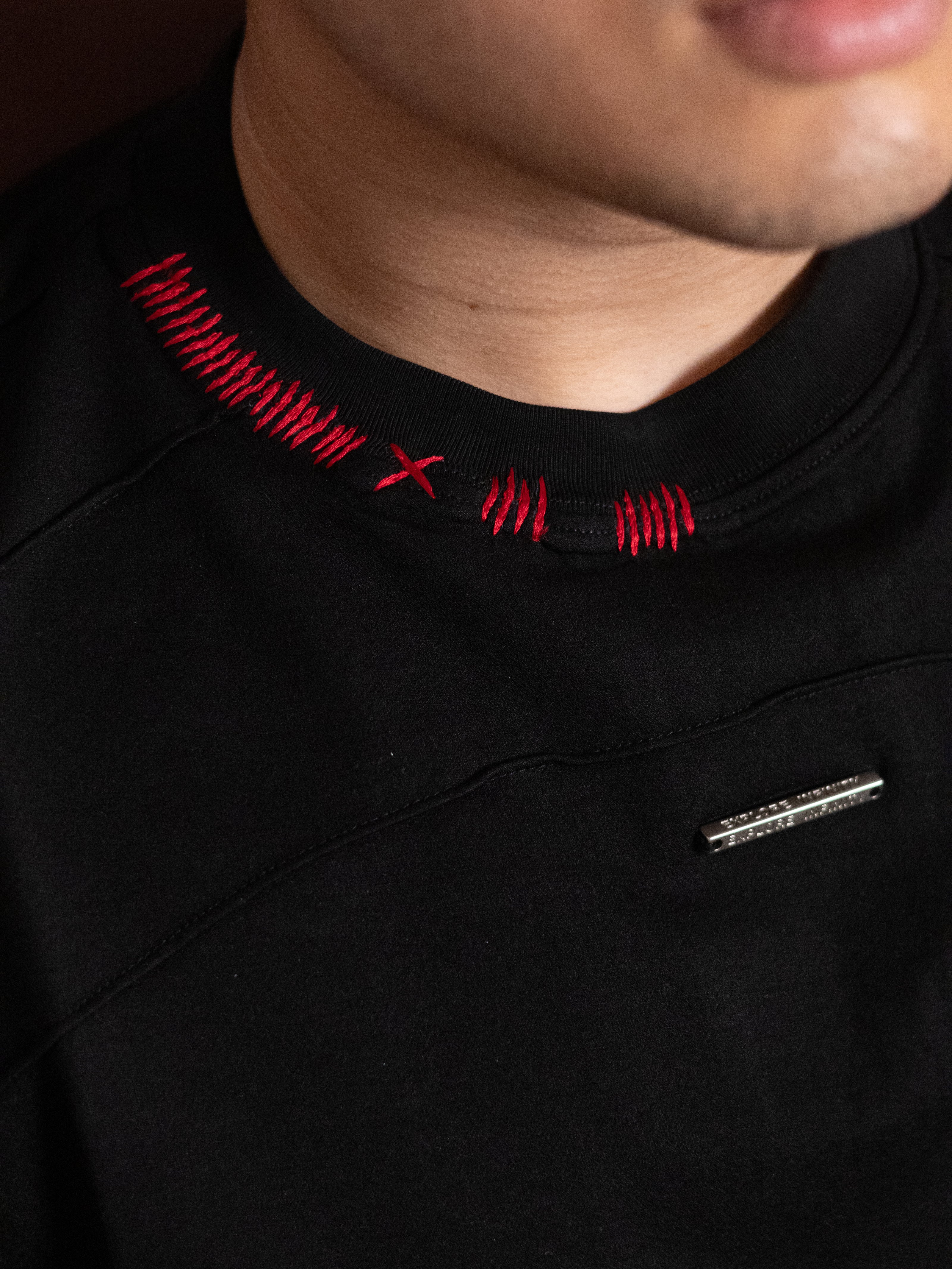 Jet Black Sashiko Stitch Tee, featuring a round neck with distinct red thread detailing